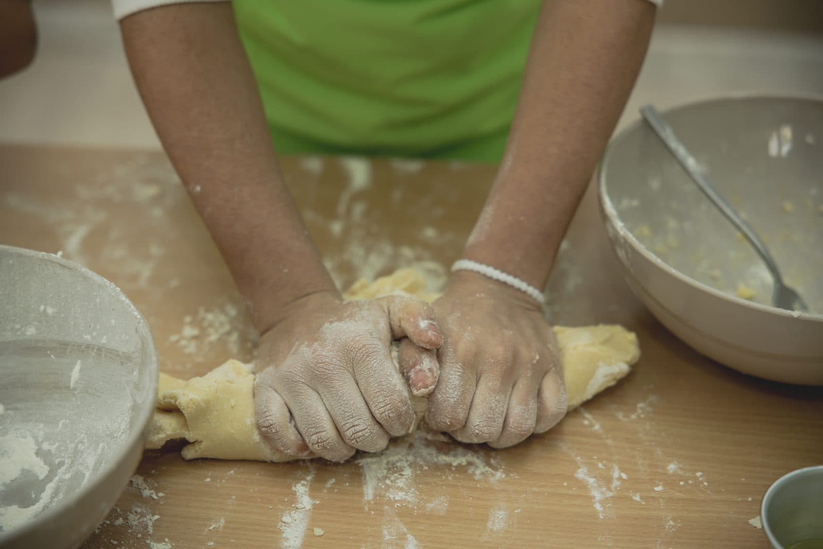 Hands kneading dough